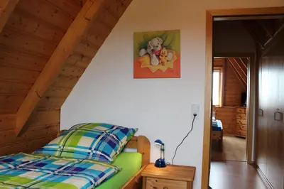 Ein Bett oder Betten in einem Zimmer der Unterkunft Ferienhaus Carolin am Nordseedeich