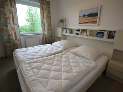 Ein Bett oder Betten in einem Zimmer der Unterkunft Residenz Atlantic mit Hallenbad und Sauna