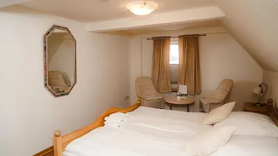 Ein Bett oder Betten in einem Zimmer der Unterkunft Zur-Erholung Büsum
