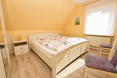 Ein Bett oder Betten in einem Zimmer der Unterkunft Haus Birte