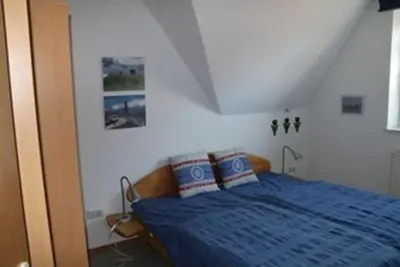 Ein Bett oder Betten in einem Zimmer der Unterkunft FEWO Wald&Meer