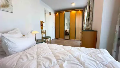 Ein Bett oder Betten in einem Zimmer der Unterkunft Elegantes Apartment Ankerplatz Duhnen