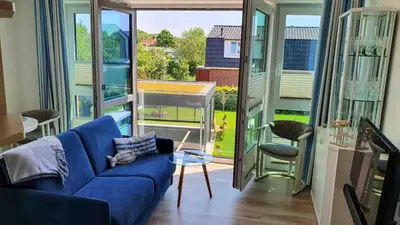 Ein Sitzbereich in der Unterkunft Elegantes Apartment Ankerplatz Duhnen