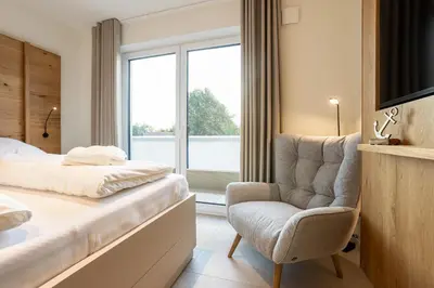 Ein Bett oder Betten in einem Zimmer der Unterkunft Dorumer Sielhuus 17