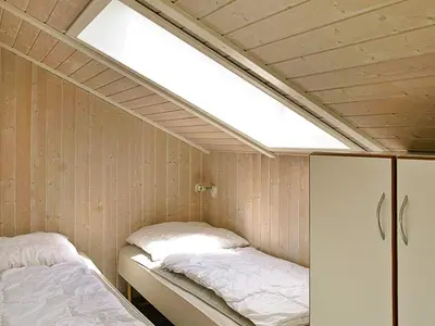 Ein Bett oder Betten in einem Zimmer der Unterkunft 12 person holiday home in Otterndorf