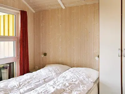 Ein Bett oder Betten in einem Zimmer der Unterkunft 12 person holiday home in Otterndorf