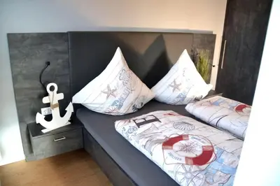 Ein Bett oder Betten in einem Zimmer der Unterkunft Meeresleuchten Duhnen-Entrée 8