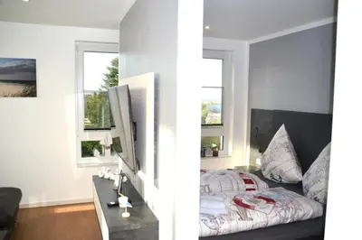 Ein Bett oder Betten in einem Zimmer der Unterkunft Meeresleuchten Duhner Entrée - 8