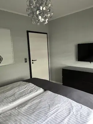 Ein Bett oder Betten in einem Zimmer der Unterkunft Apartment MeerZeit Wohnung 207