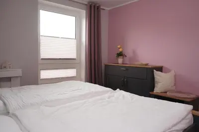Ein Bett oder Betten in einem Zimmer der Unterkunft Kurpark Domizil 3
