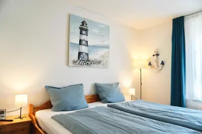 Ein Bett oder Betten in einem Zimmer der Unterkunft Haus Strandflieder