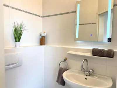 Ein Badezimmer in der Unterkunft Haus Küstenkörbchen