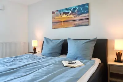 Ein Bett oder Betten in einem Zimmer der Unterkunft Ferienwohnung de Hahnpoten