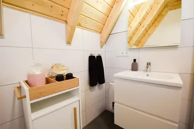 Ein Badezimmer in der Unterkunft Ferienhaus Mellumplate 23