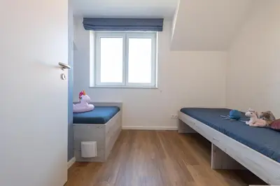 Ein Bett oder Betten in einem Zimmer der Unterkunft Ferienreihenhaus 