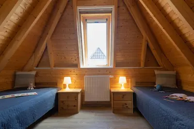 Ein Bett oder Betten in einem Zimmer der Unterkunft Ferienhaus Mellumplate 62