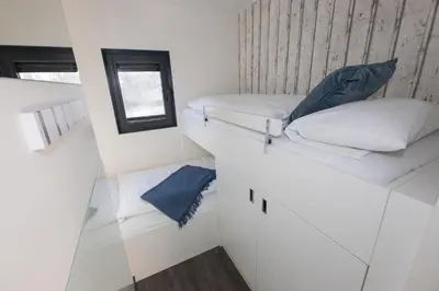 Ein Bett oder Betten in einem Zimmer der Unterkunft Hausboot 
