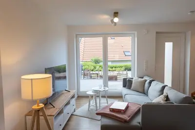 Ein Sitzbereich in der Unterkunft Ferienreihenhaus Lale Andersen 4c