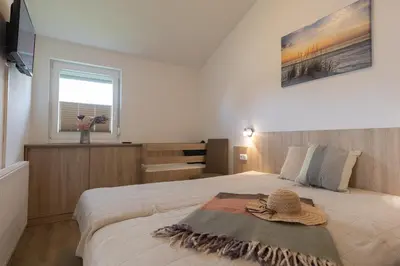 Ein Bett oder Betten in einem Zimmer der Unterkunft Ferienhaus 