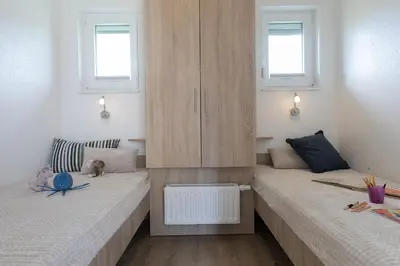 Ein Bett oder Betten in einem Zimmer der Unterkunft Ferienhaus 