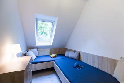 Ein Bett oder Betten in einem Zimmer der Unterkunft Ferienwohnung Sieltrift 4-06