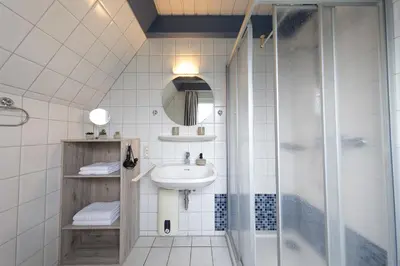 Ein Badezimmer in der Unterkunft Ferienhaus Vogelsand 02