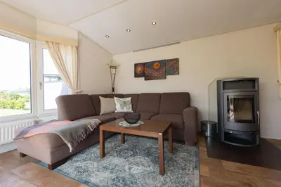 Ein Sitzbereich in der Unterkunft Ferienhaus Mellumplate 10
