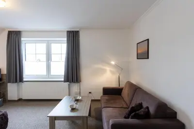 Ein Sitzbereich in der Unterkunft Cuxlandhotel Doppelzimmer 114