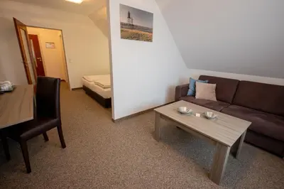 Ein Bett oder Betten in einem Zimmer der Unterkunft Cuxlandhotel Studio 203