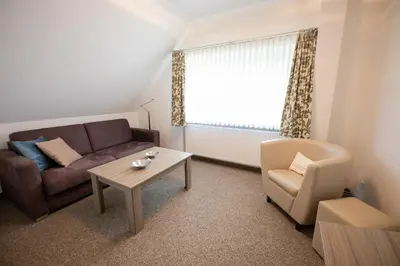 Ein Sitzbereich in der Unterkunft Cuxlandhotel Studio 203