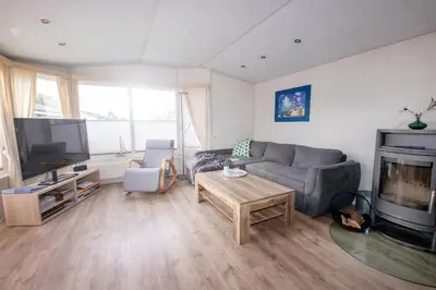 Ein Sitzbereich in der Unterkunft Ferienhaus Mellumplate 08