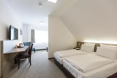 Ein Bett oder Betten in einem Zimmer der Unterkunft Cuxlandhotel Studio 201