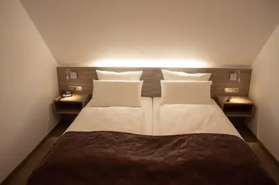 Ein Bett oder Betten in einem Zimmer der Unterkunft Cuxlandhotel Studio 204