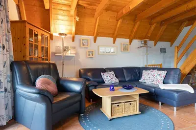 Ein Sitzbereich in der Unterkunft Ferienhaus Medemsand 15