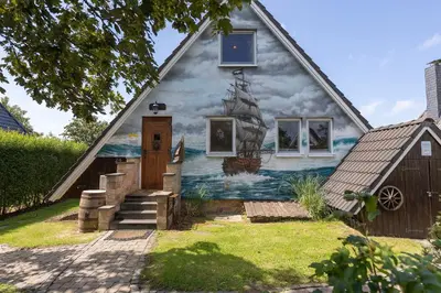 Ein Garten an der Unterkunft Ferienhaus Opi Huck Stroot 24