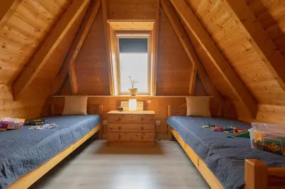Ein Bett oder Betten in einem Zimmer der Unterkunft Ferienhaus Medemsand 08
