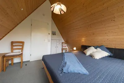 Ein Bett oder Betten in einem Zimmer der Unterkunft Ferienhaus 