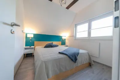 Ein Bett oder Betten in einem Zimmer der Unterkunft Ferienhaus 