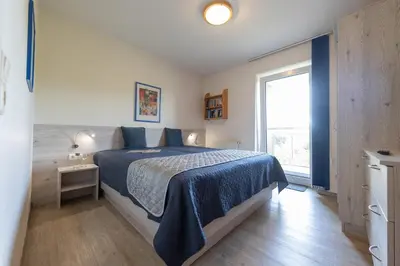 Ein Bett oder Betten in einem Zimmer der Unterkunft Ferienwohnung 