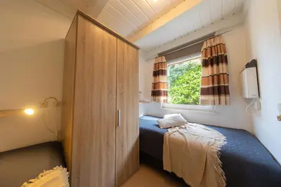 Ein Bett oder Betten in einem Zimmer der Unterkunft Ferienhaus Vogelsand 10