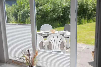 Ein Garten an der Unterkunft Ferienhaus Kniepsand 08