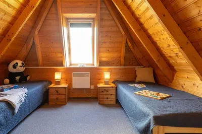 Ein Bett oder Betten in einem Zimmer der Unterkunft Ferienhaus Westertill 06