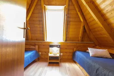 Ein Bett oder Betten in einem Zimmer der Unterkunft Ferienhaus Opi Huck Stroot 41