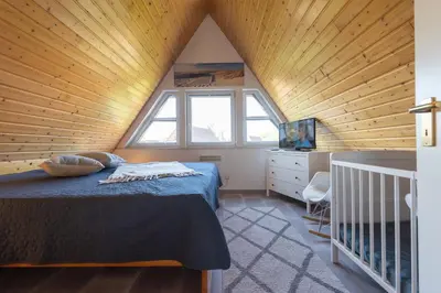 Ein Bett oder Betten in einem Zimmer der Unterkunft Ferienhaus 