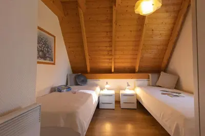 Ein Bett oder Betten in einem Zimmer der Unterkunft Ferienhaus Westertill 14
