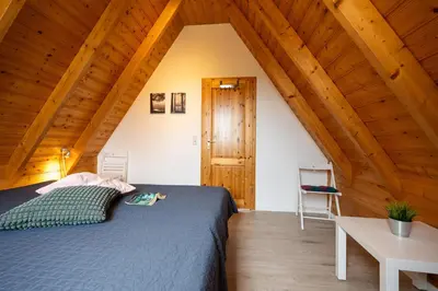 Ein Bett oder Betten in einem Zimmer der Unterkunft Ferienhaus Mellumplate 34