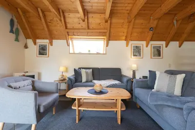 Ein Sitzbereich in der Unterkunft Ferienhaus Westertill 10