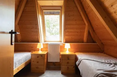 Ein Bett oder Betten in einem Zimmer der Unterkunft Ferienhaus Wittsand 11