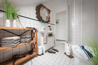Ein Badezimmer in der Unterkunft Die Ferienwohnung direkt am Meer