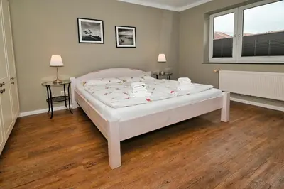 Ein Bett oder Betten in einem Zimmer der Unterkunft Wohnung Austernfischer